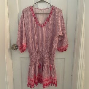 Fun pink print boutique dress with convex/ruched waist and tassel details
